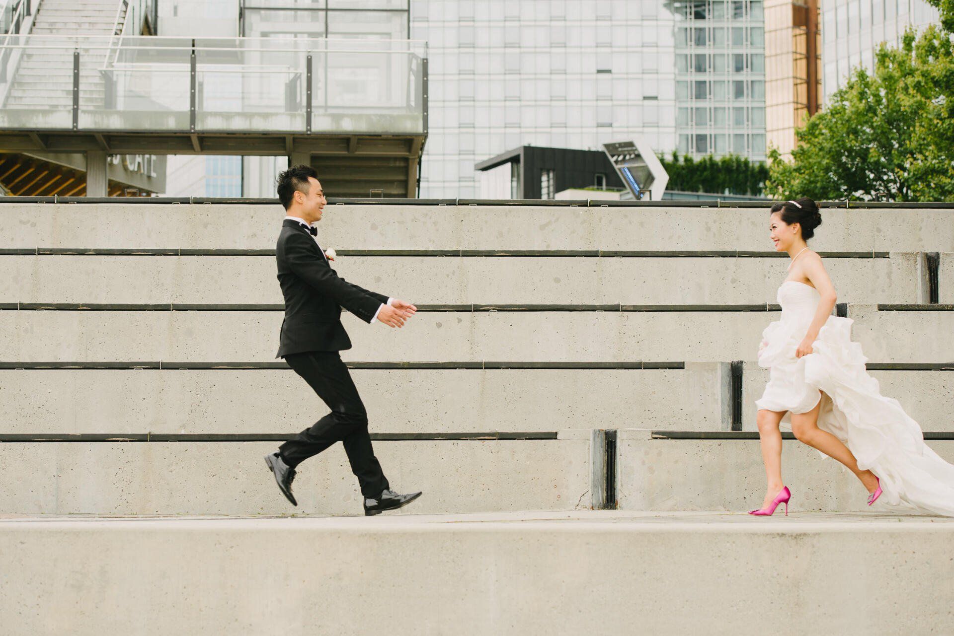 A bride and groom running towards each other