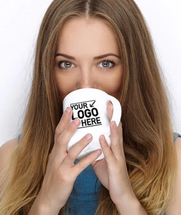 Woman holding a white mug with 