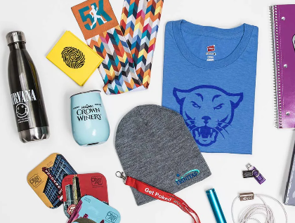 Assortment of athletic gear, including a water bottle, headband, and t-shirt, on a white background.