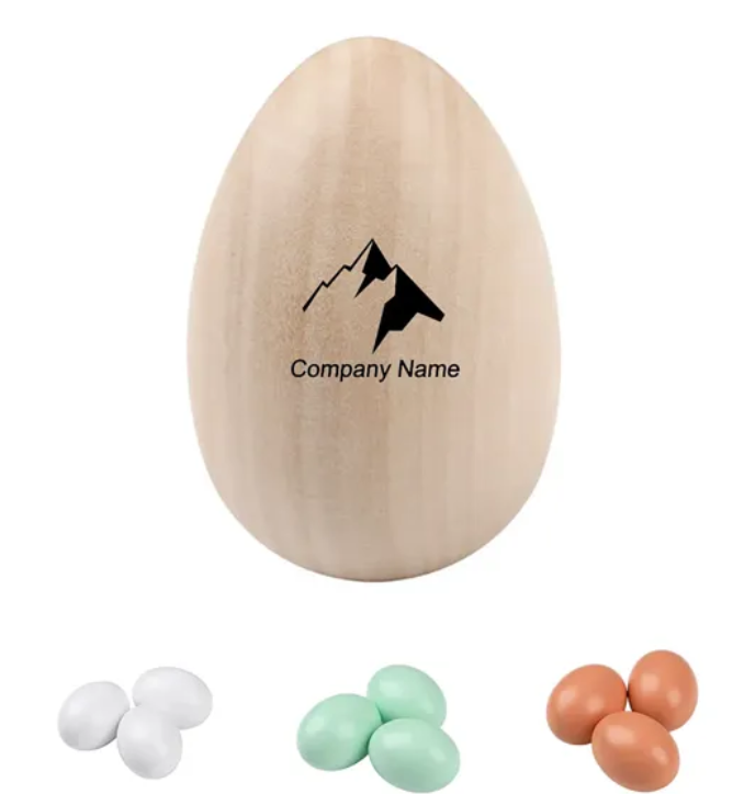 Wooden egg with a mountain logo and three sets of colored easter eggs below.