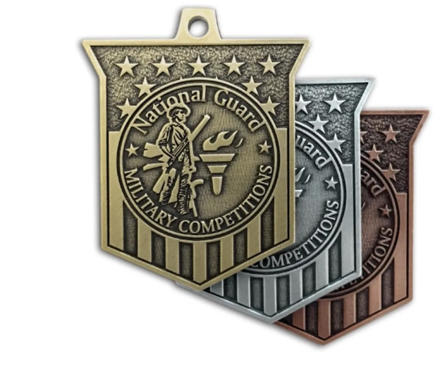 Three National Guard Military Competitions medals in gold, silver, and bronze.