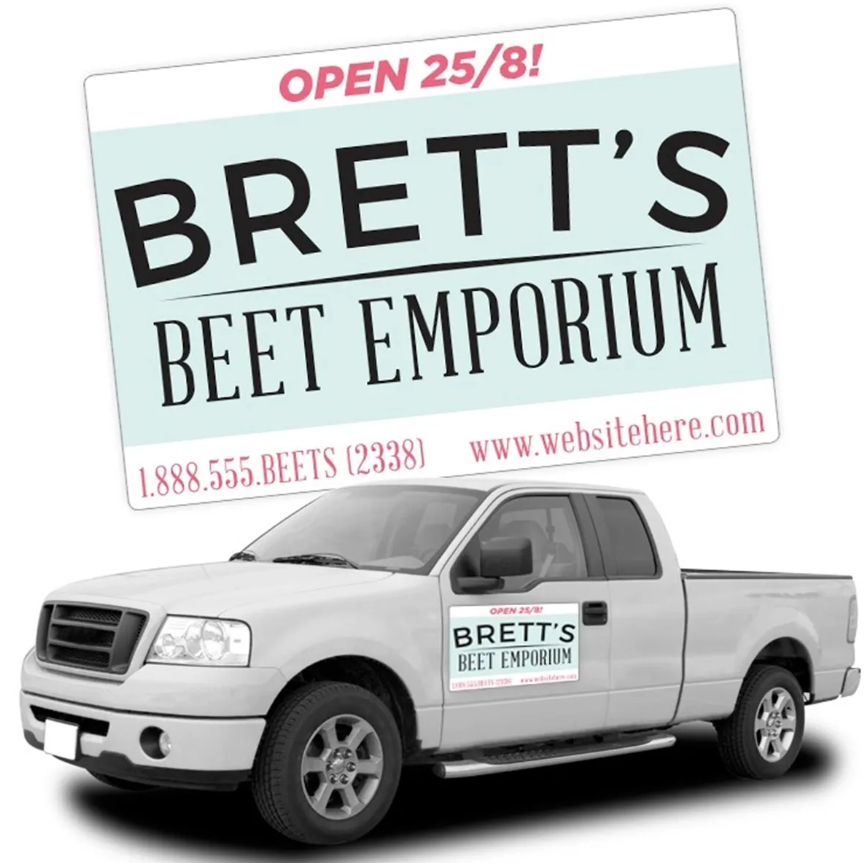 A white pickup truck with a magnetic sign for Brett's Beet Emporium. Sign reads 