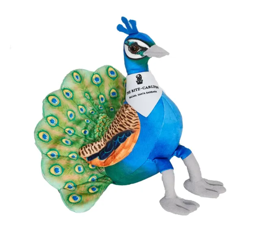Plush peacock with blue body, green tail, and white bandana.