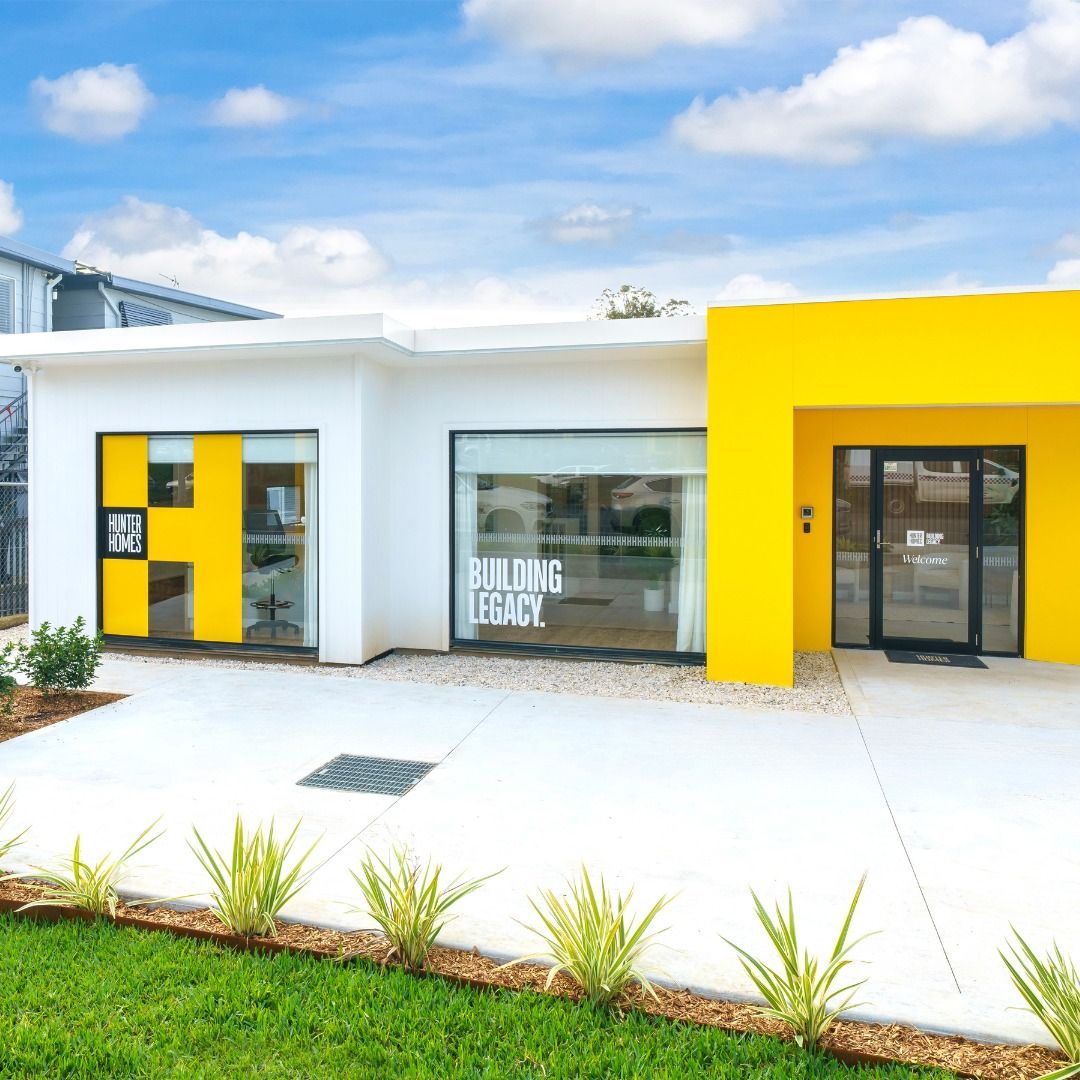 Bright White and Yellow Building with A Glass Storefront. Blue Sky — Hunter Home Services in Port Stephens, NSW