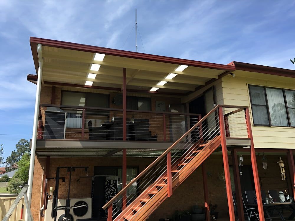 A House With Stairs Leading Up To The Second Floor — Hunter Home Services in Maitland, NSW