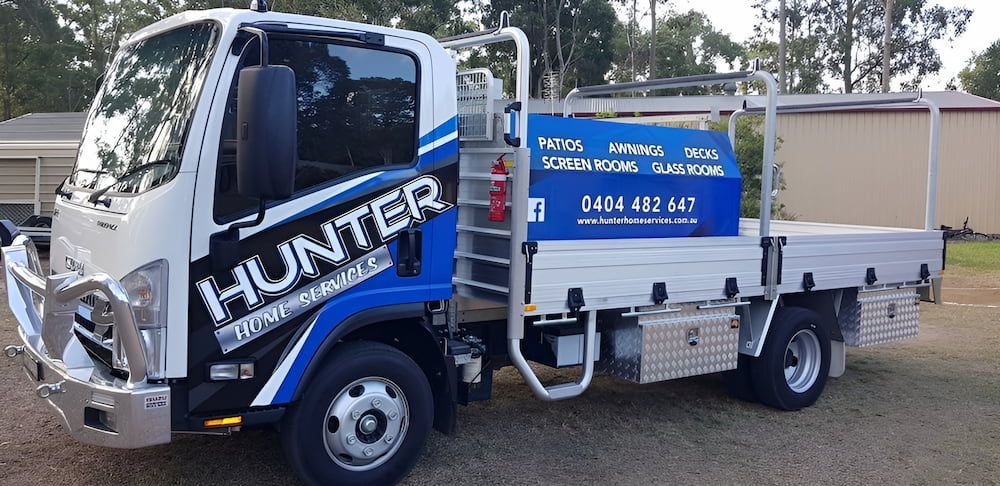 A Blue And White Truck With The Word Hunter On The Side — Hunter Home Services in Thornton, NSW