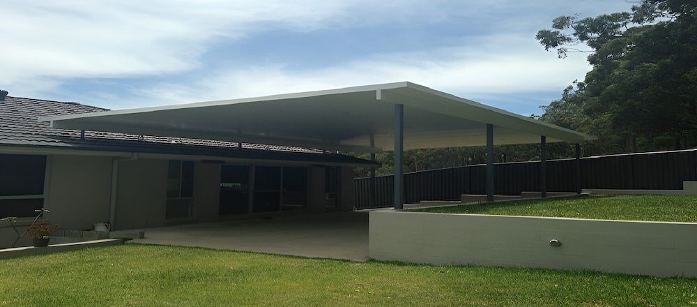 A House With A Large Covered Area In Front Of It — Hunter Home Services in Maitland, NSW