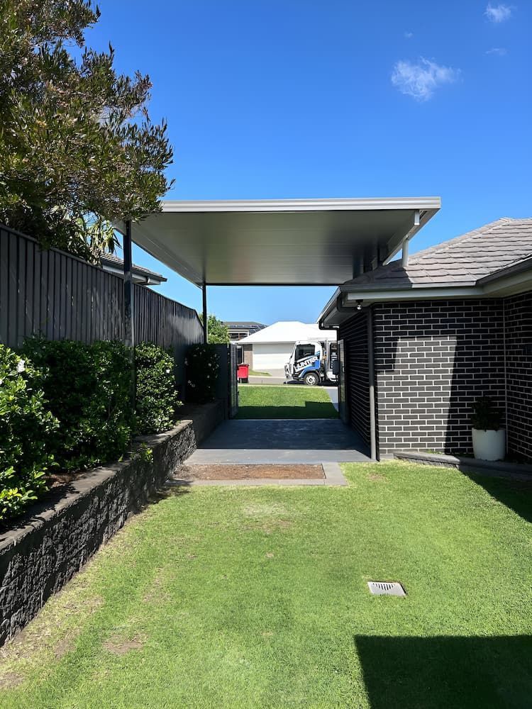 There Is A Carport In The Backyard Of A House — Hunter Home Services in Cameron Park, NSW