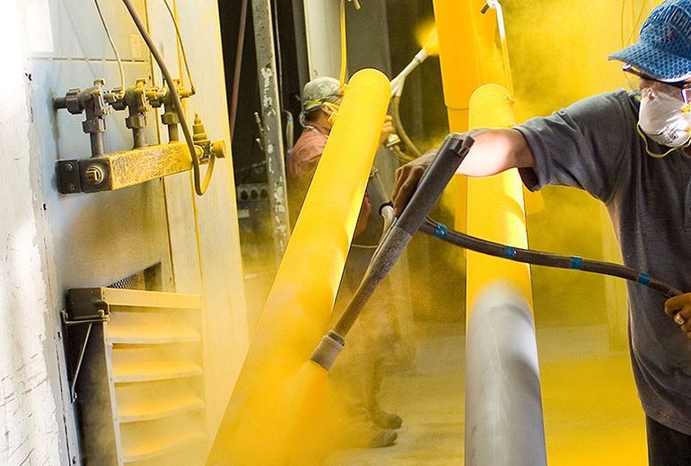 Man Doing Powder Coating Service — Leisure Coast Powder Coaters in Unanderra, NSW