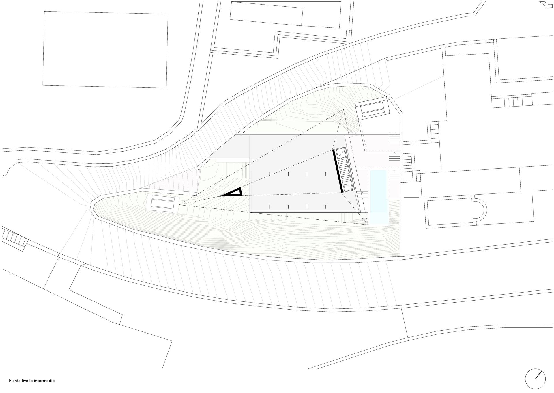 Pianta architettonica che mostra edifici e strade con linee curve.