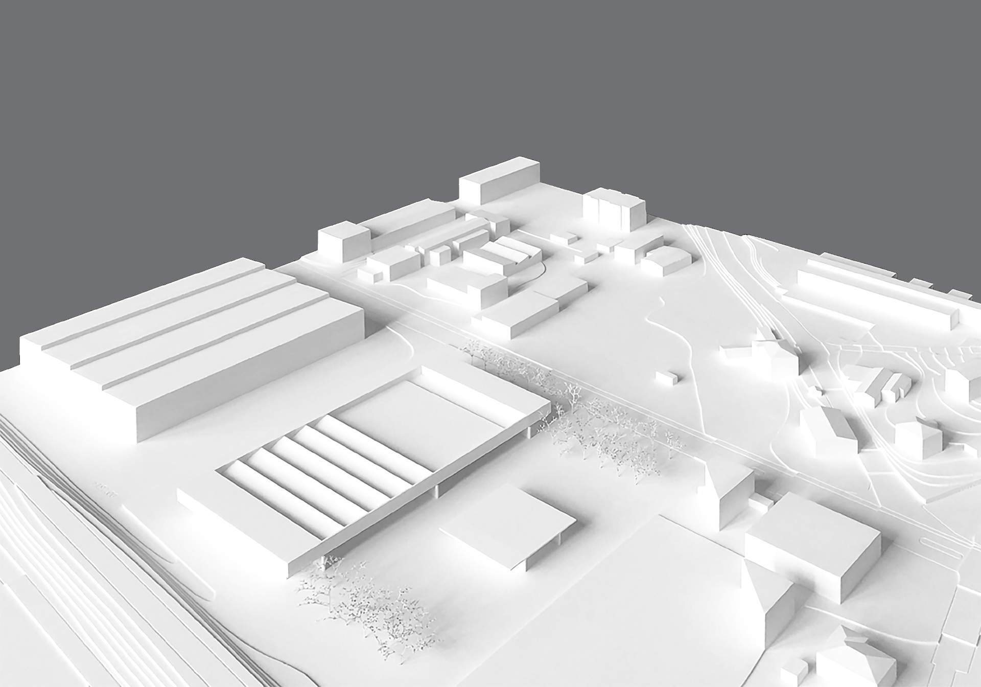 Modello 3D di un complesso industriale bianco con vari edifici e strutture su uno sfondo grigio.