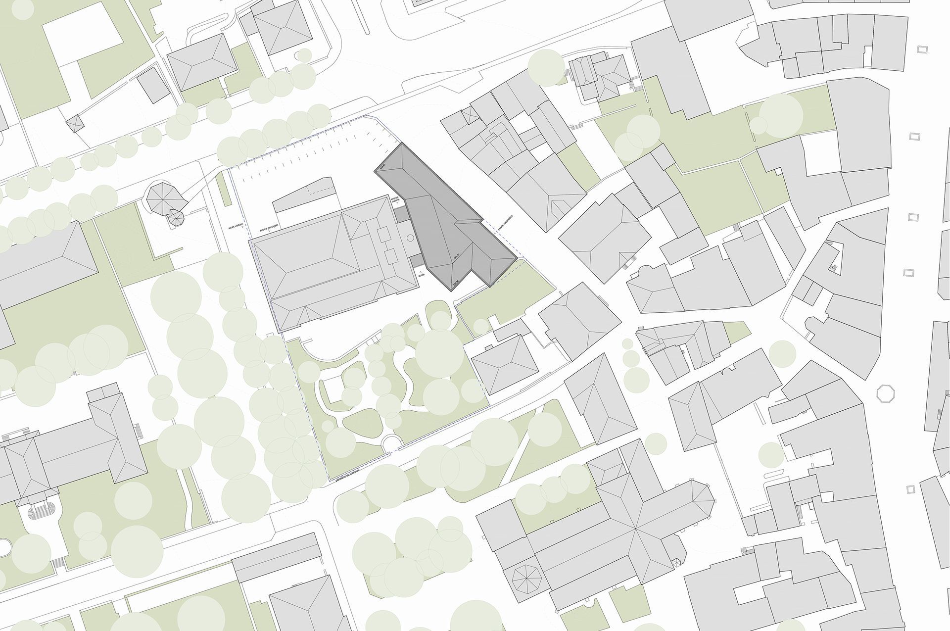 Mappa aerea che mostra isolati cittadini con edifici in grigio e alberi verdi.