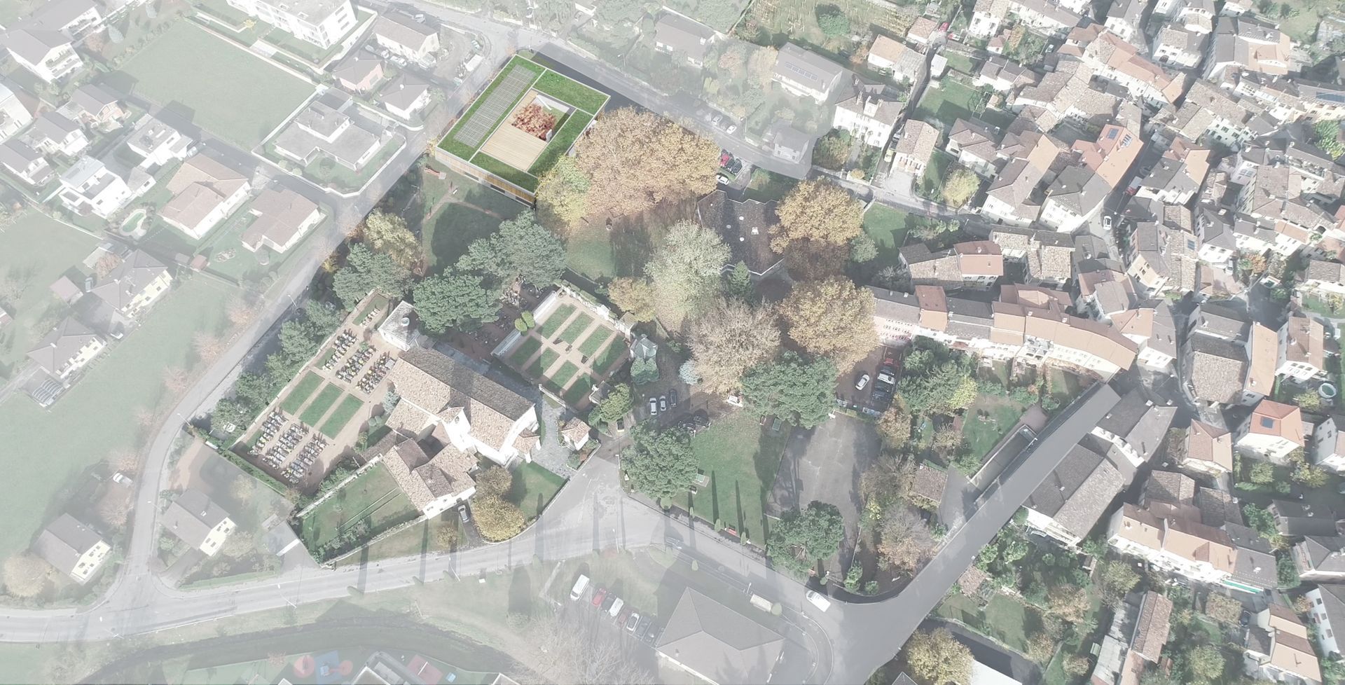 Vista aerea di una città con un parco, edifici e strade.