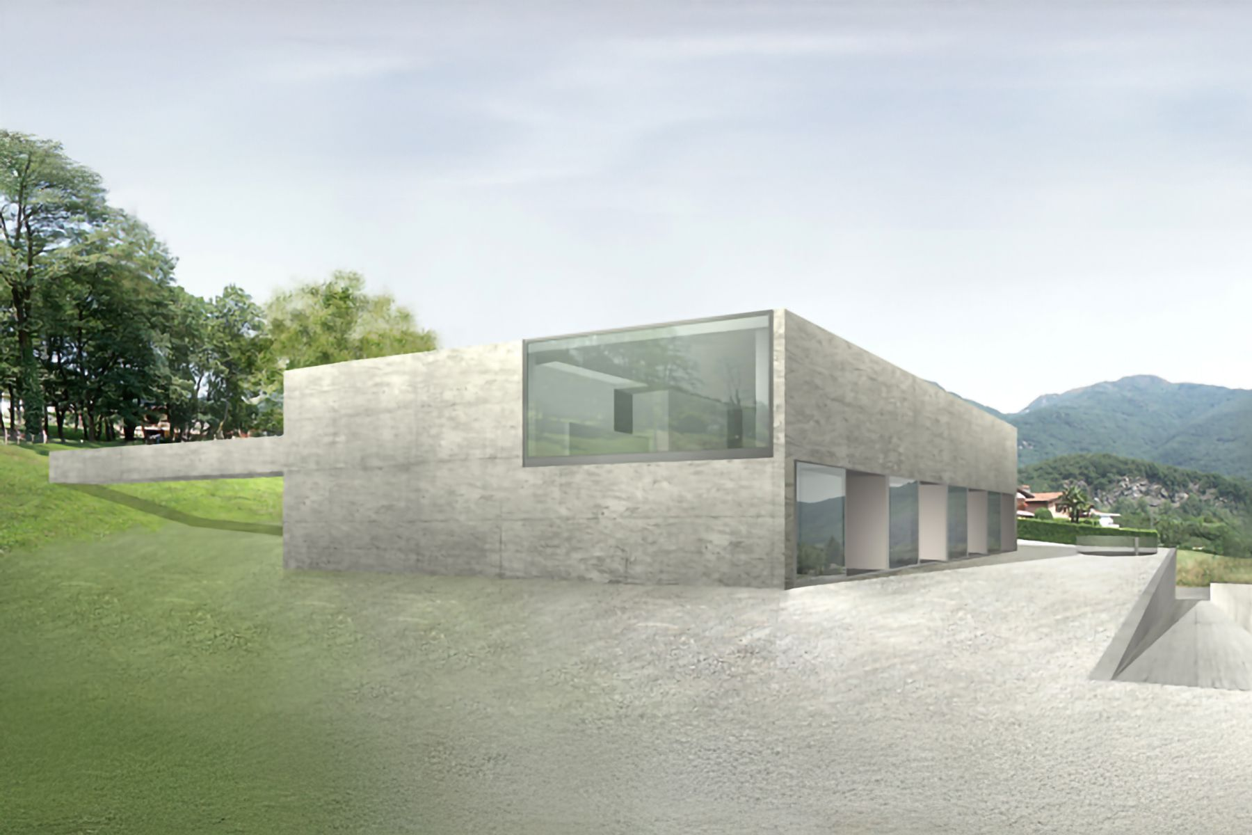 Moderno edificio in cemento con ampie finestre, situato su una collina. Alberi verdi e montagne sullo sfondo.