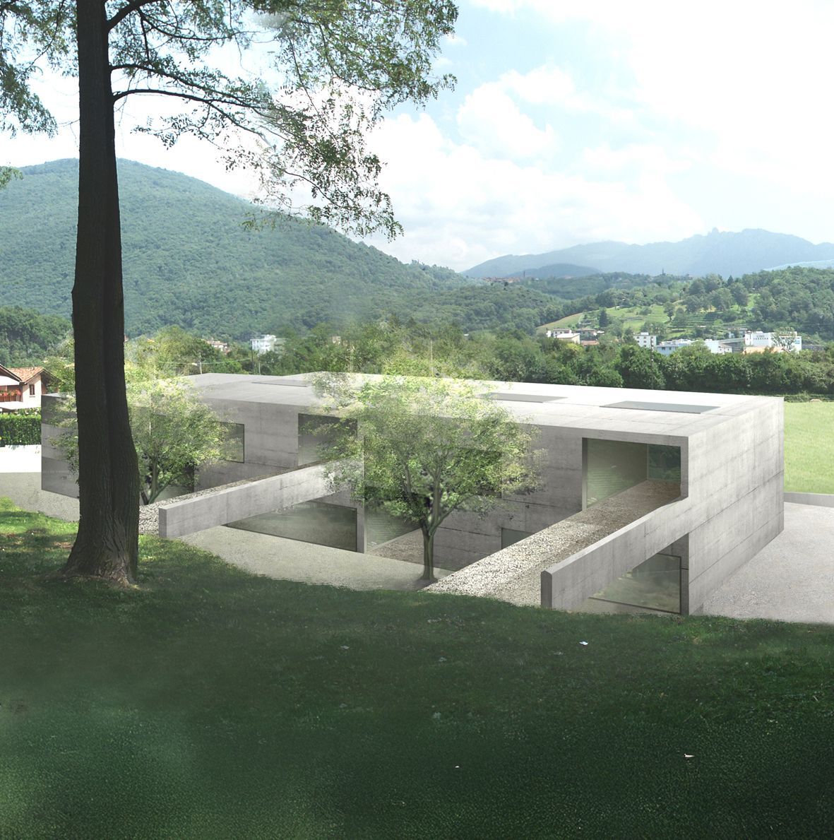 Moderno edificio in cemento con ingressi incassati, alberi e prato in primo piano, con montagne sullo sfondo.