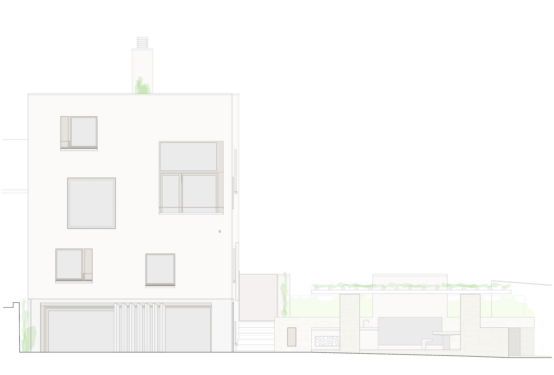 Facciata bianca di un edificio con diverse finestre e una struttura più piccola annessa sulla destra, forse un patio.