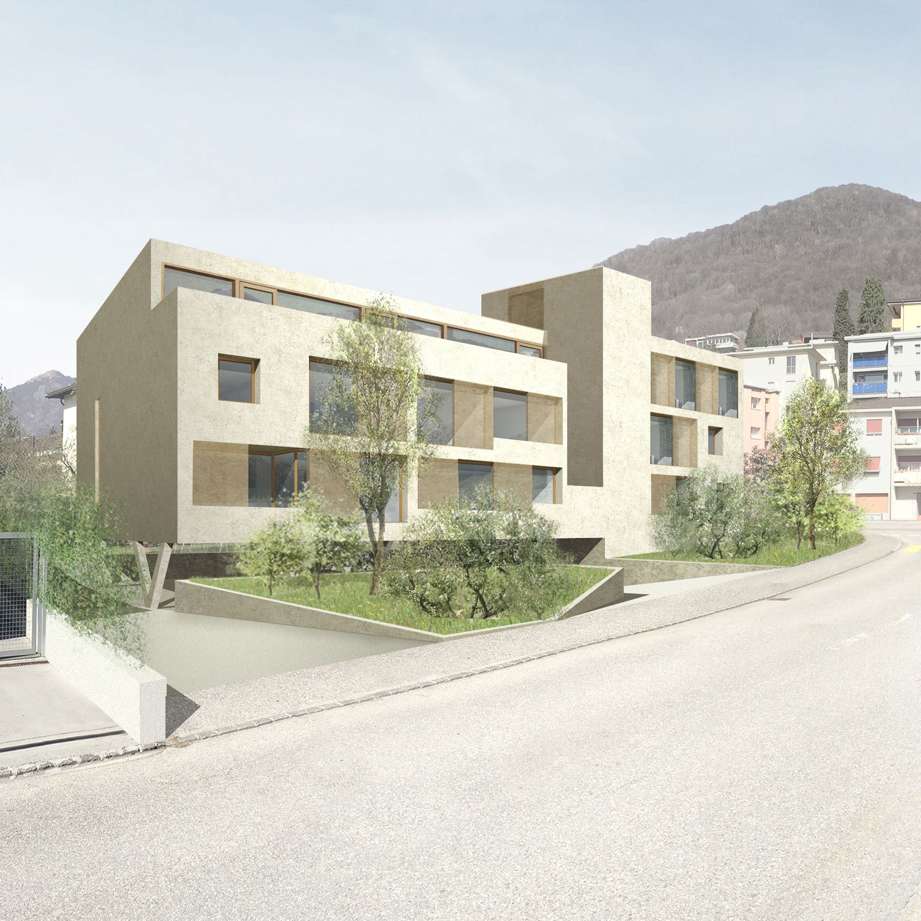 Moderno condominio beige con alberi, sullo sfondo di montagne lungo una strada in pendenza.