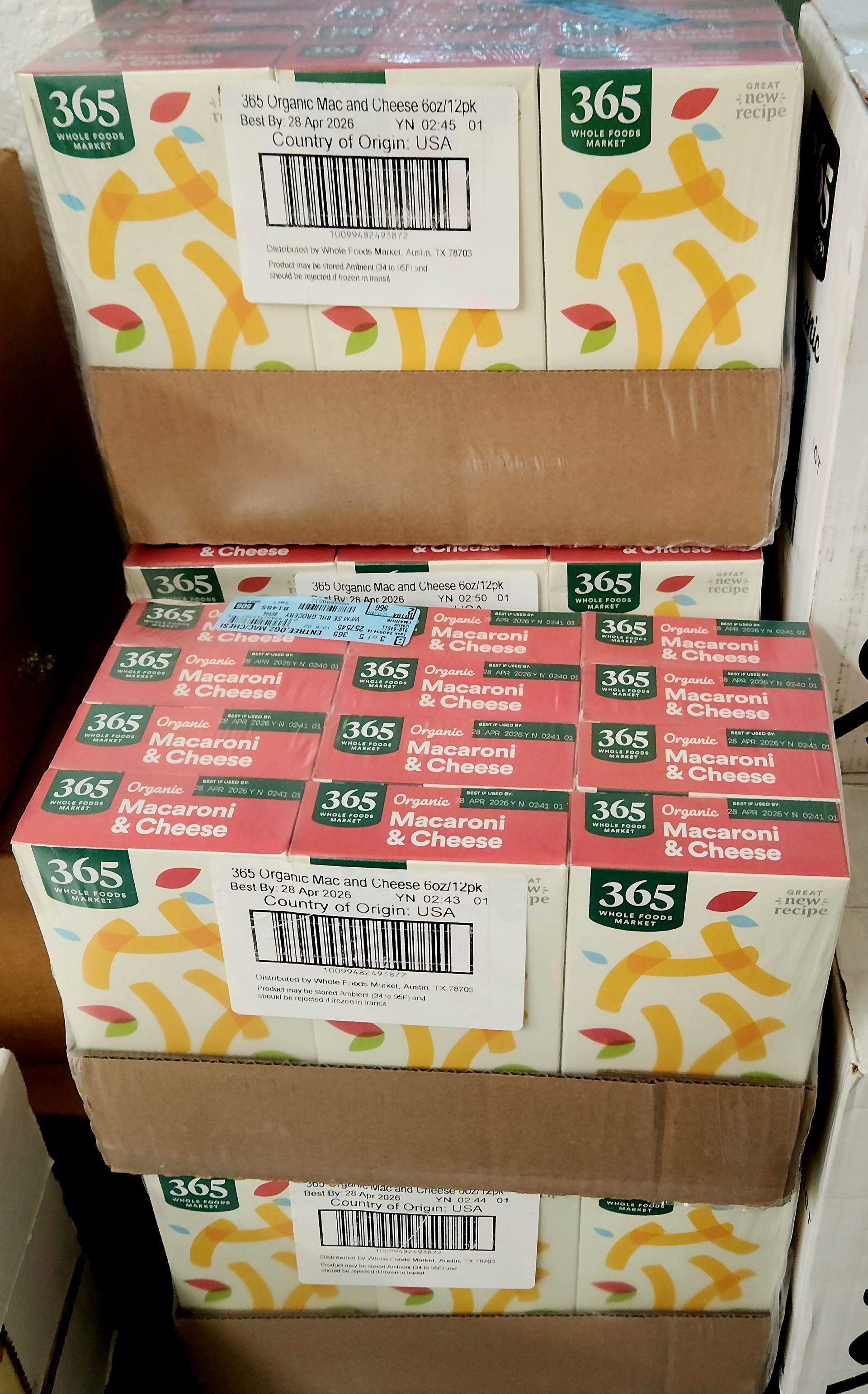 Stacked boxes of 365 brand macaroni and cheese.