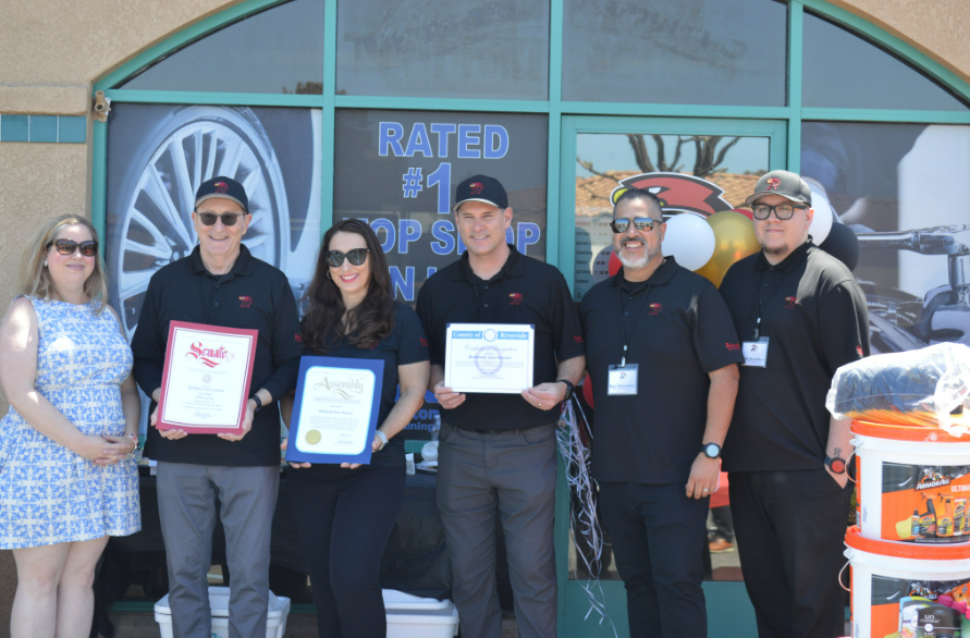 Redhawk Auto Service's Cal Oaks team with certificates at the Grand Opening celebration.