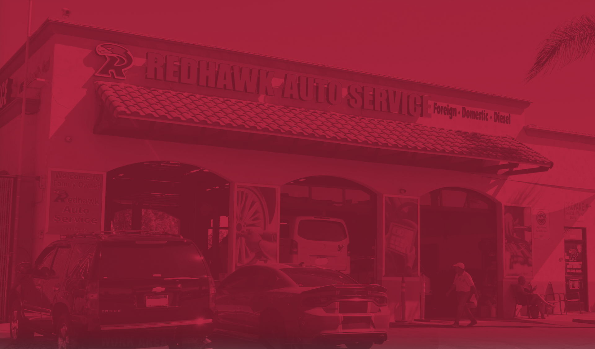 Redhawk building with red overlay background | Redhawk Auto Service