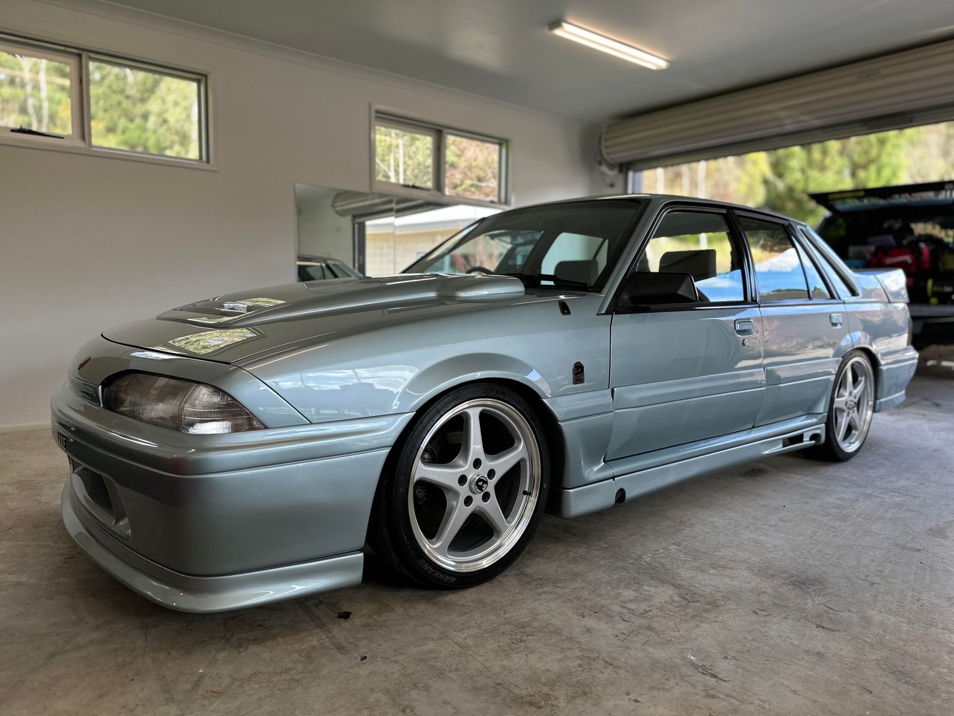 Ceramic Coating - Genuine HSV Group A Walkinshaw is parked in a garage next to a window