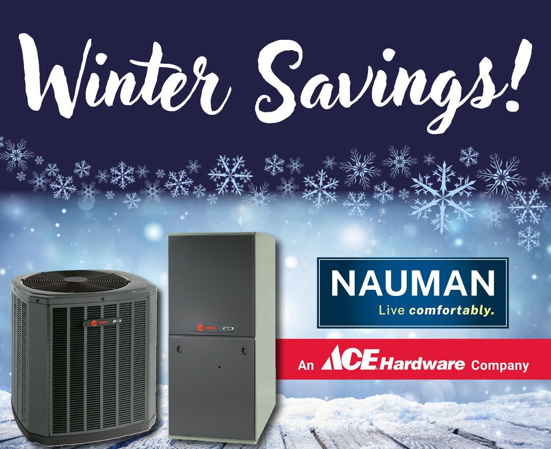 Woman sitting on couch with bowl of fruit with heating system in background.