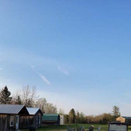 There are a lot of buildings in the background and a blue sky in the background.