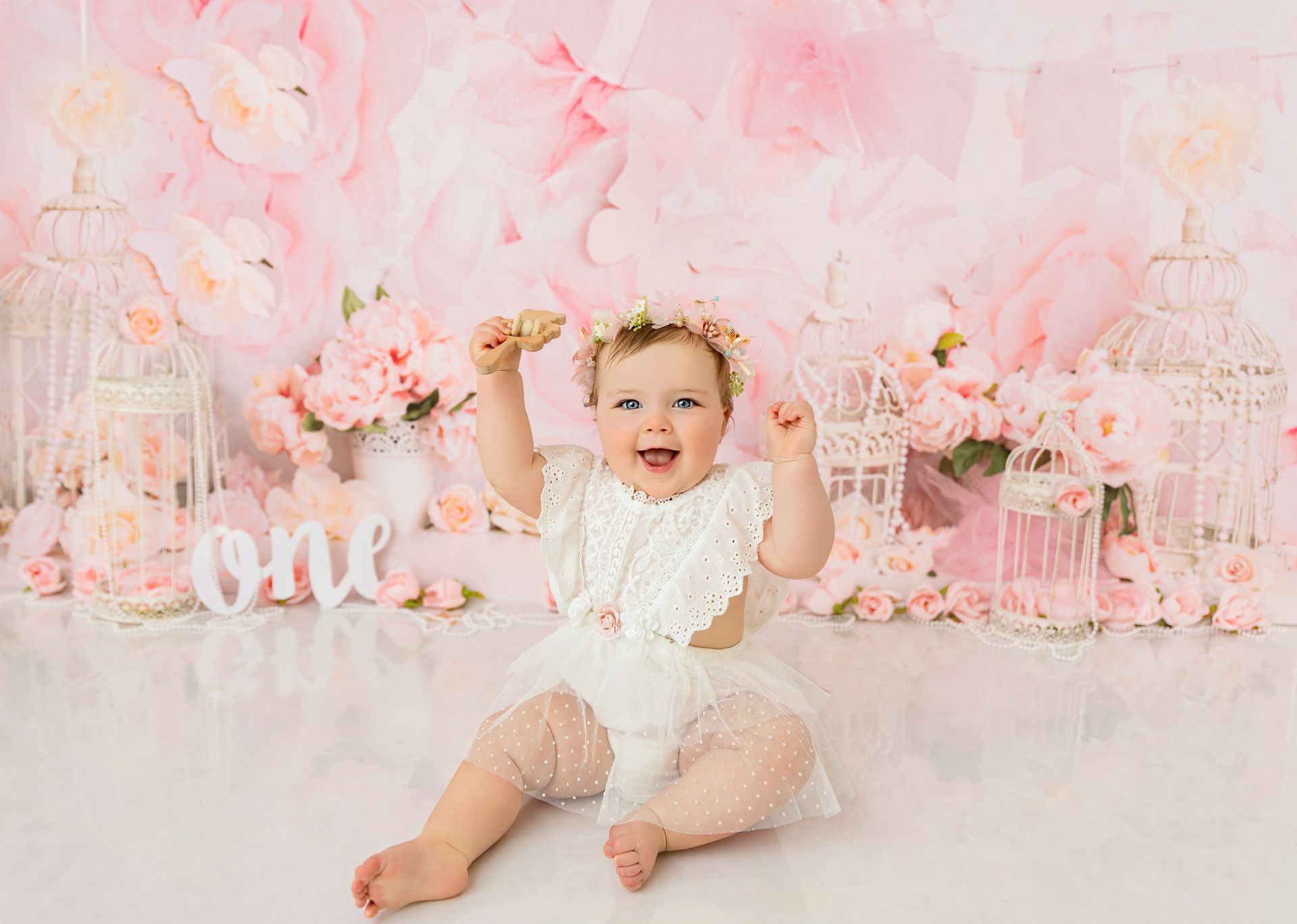 Neutral-toned floral cake smash session for first birthday in Cary, NC