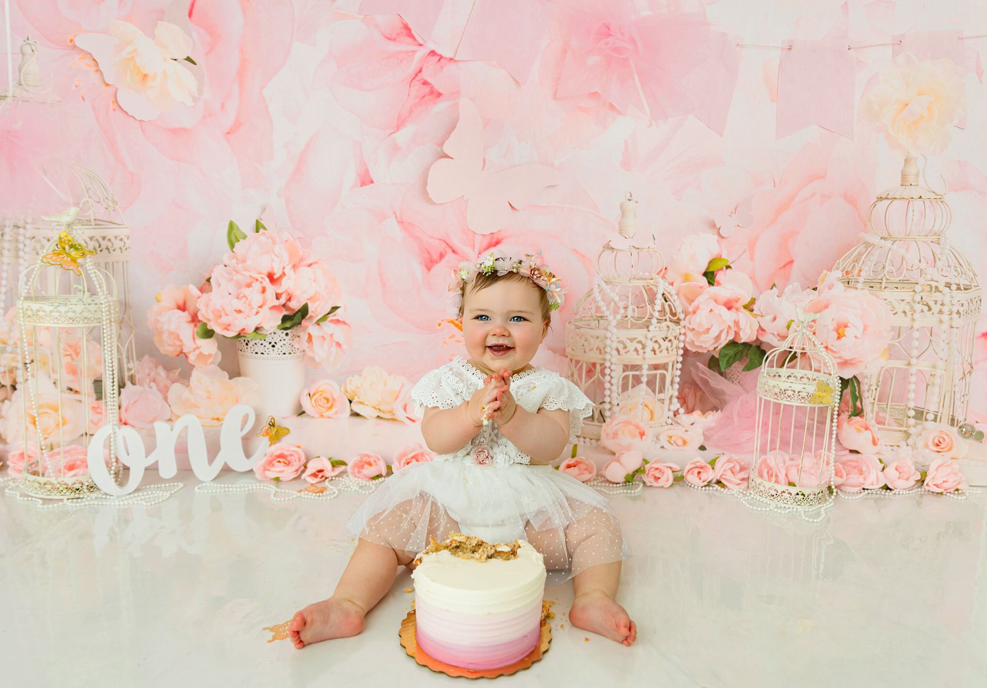 Floral-themed cake smash studio session for baby girl in Cary, NC