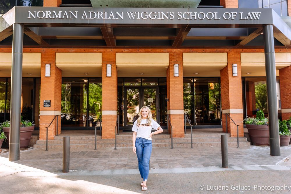 Graduation portrait session by Luciana Galucci Photography at Campbell University School of Law in Raleigh, North Carolina featuring cap and gown near the courthouse