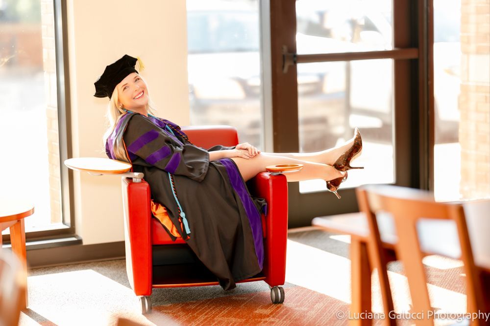 Graduation portrait session by Luciana Galucci Photography at Campbell University School of Law in Raleigh, North Carolina featuring cap and gown near the courthouse