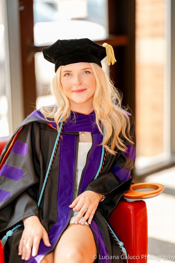 Graduation portrait session by Luciana Galucci Photography at Campbell University School of Law in Raleigh, North Carolina featuring cap and gown near the courthouse
