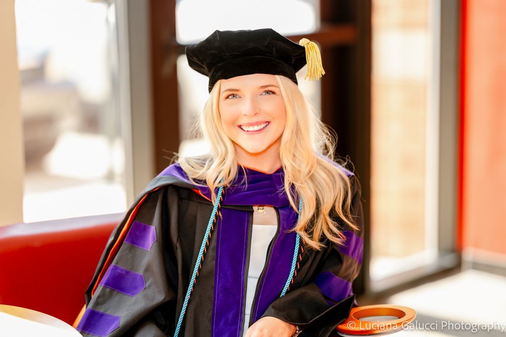 Graduation portrait session by Luciana Galucci Photography at Campbell University School of Law in Raleigh, North Carolina featuring cap and gown near the courthouse