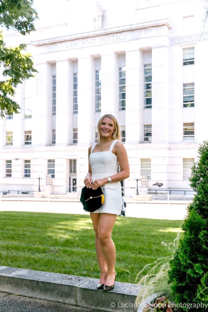 Graduation portrait session by Luciana Galucci Photography at Campbell University School of Law in Raleigh, North Carolina featuring cap and gown near the courthouse