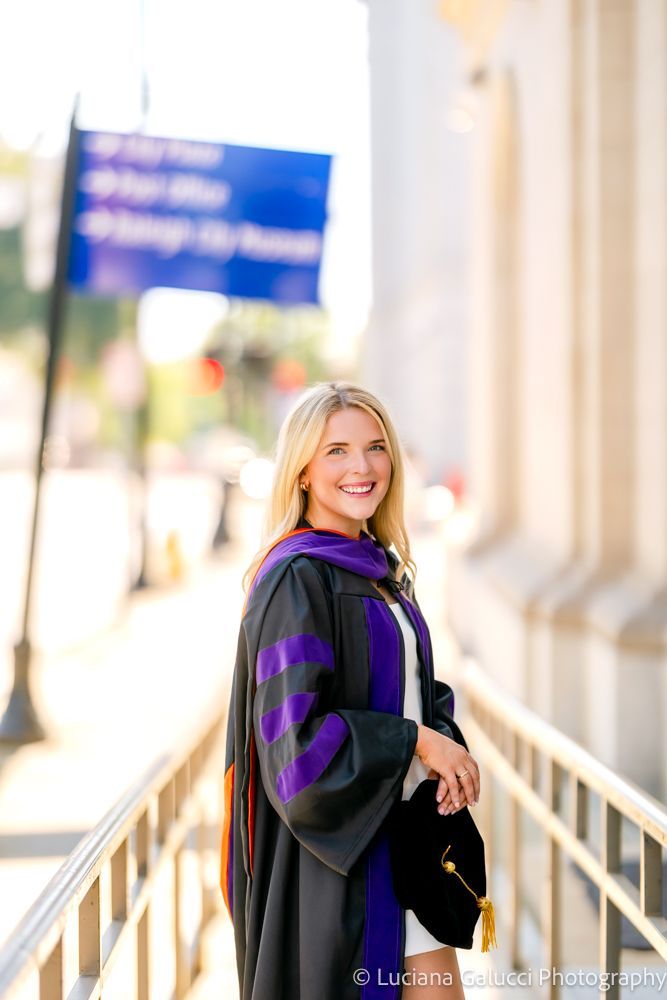 Graduation portrait session by Luciana Galucci Photography at Campbell University School of Law in Raleigh, North Carolina featuring cap and gown near the courthouse