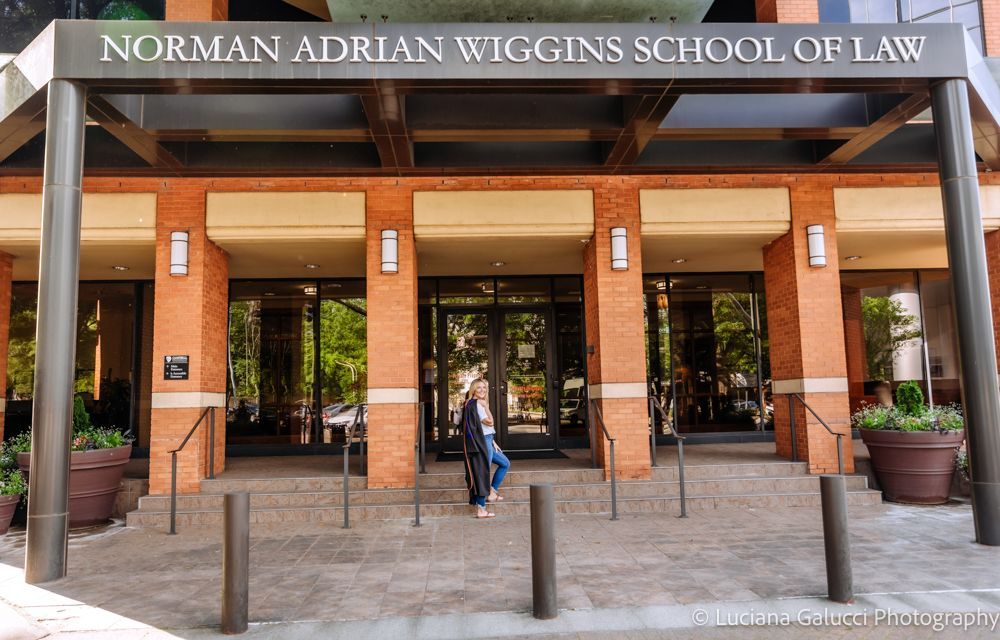 Graduation portrait session by Luciana Galucci Photography at Campbell University School of Law in Raleigh, North Carolina featuring cap and gown near the courthouse