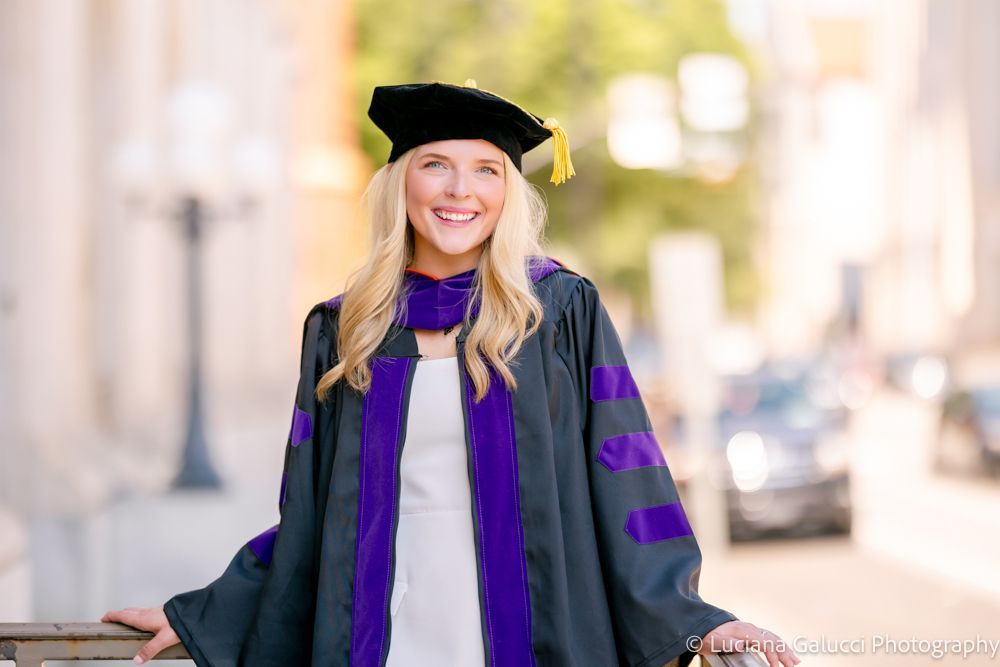 Graduation portrait session by Luciana Galucci Photography at Campbell University School of Law in Raleigh, North Carolina featuring cap and gown near the courthouse