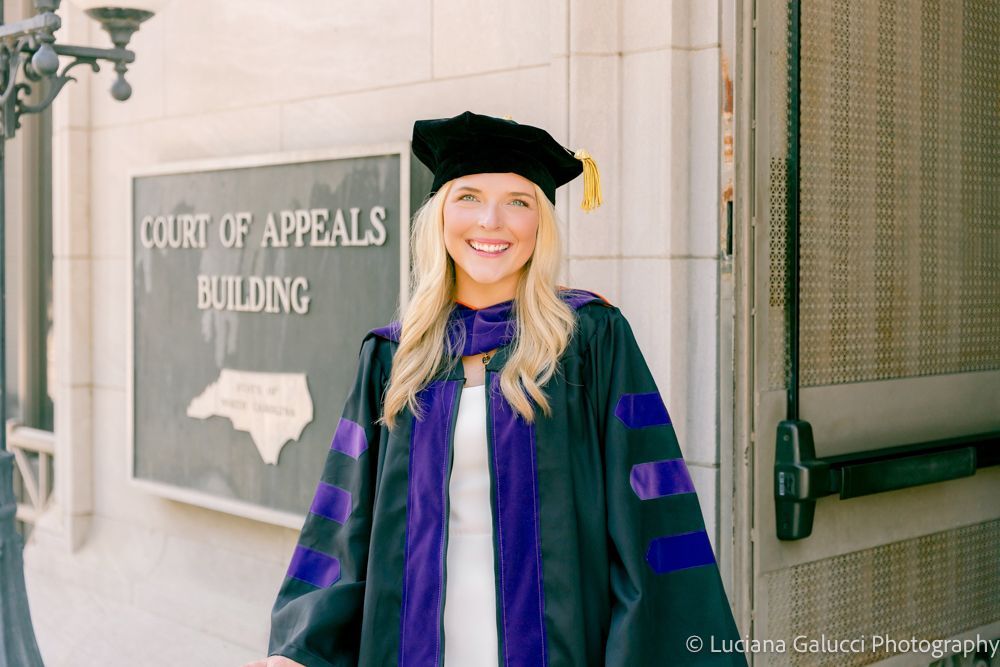 Graduation portrait session by Luciana Galucci Photography at Campbell University School of Law in Raleigh, North Carolina featuring cap and gown near the courthouse