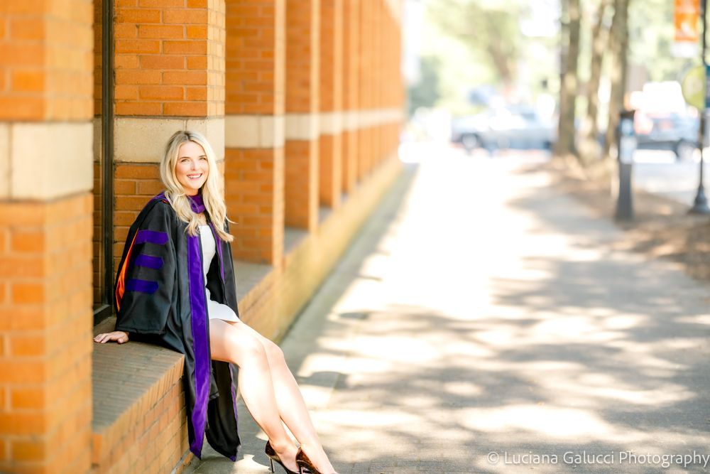 Graduation portrait session by Luciana Galucci Photography at Campbell University School of Law in Raleigh, North Carolina featuring cap and gown near the courthouse