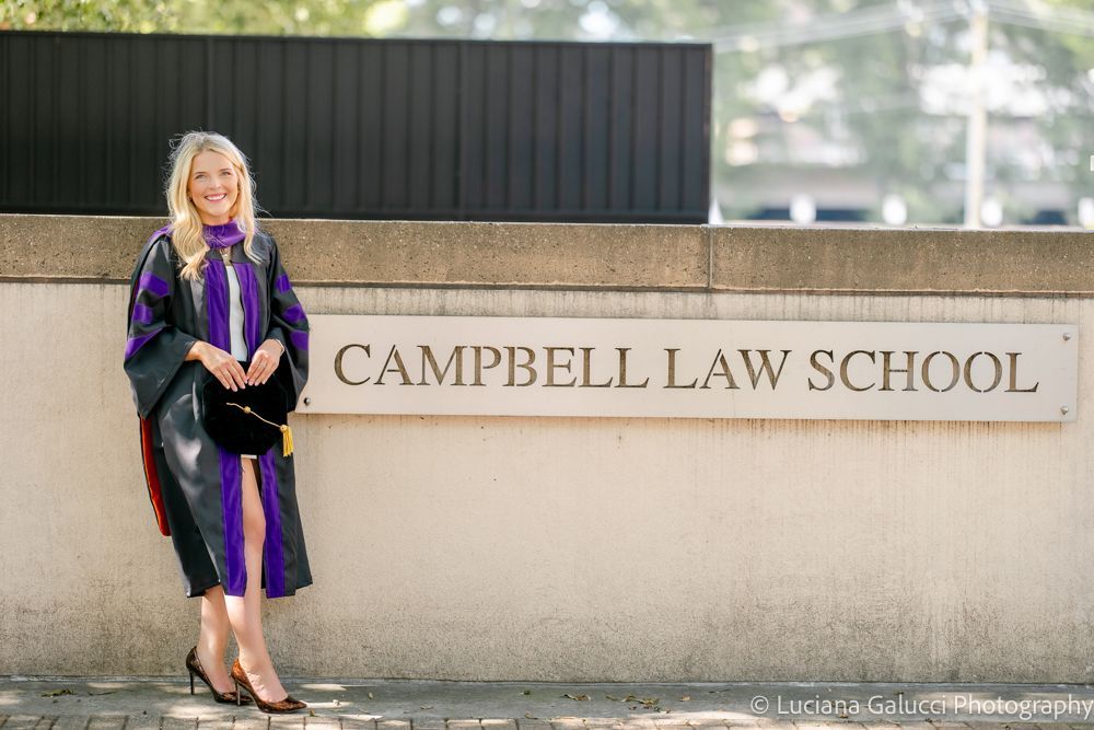 Graduation portrait session by Luciana Galucci Photography at Campbell University School of Law in Raleigh, North Carolina featuring cap and gown near the courthouse