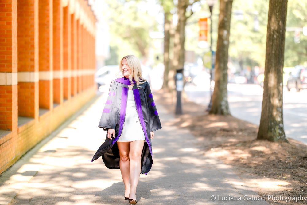 Graduation portrait session by Luciana Galucci Photography at Campbell University School of Law in Raleigh, North Carolina featuring cap and gown near the courthouse