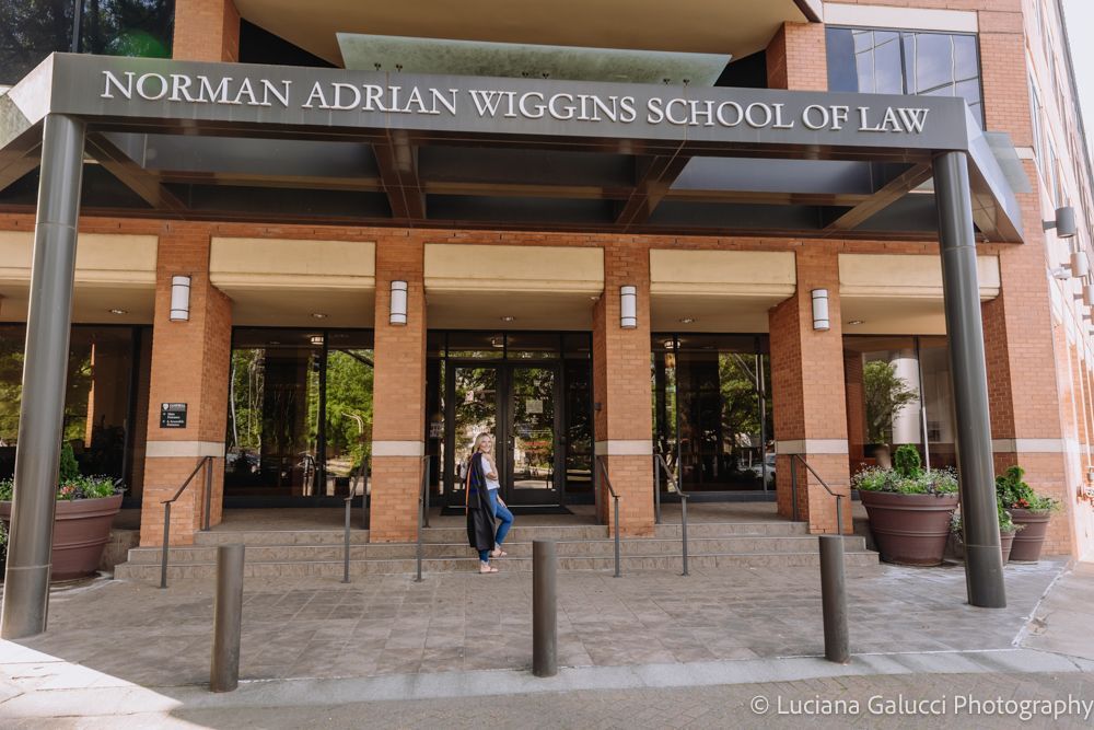 Graduation portrait session by Luciana Galucci Photography at Campbell University School of Law in Raleigh, North Carolina featuring cap and gown near the courthouse