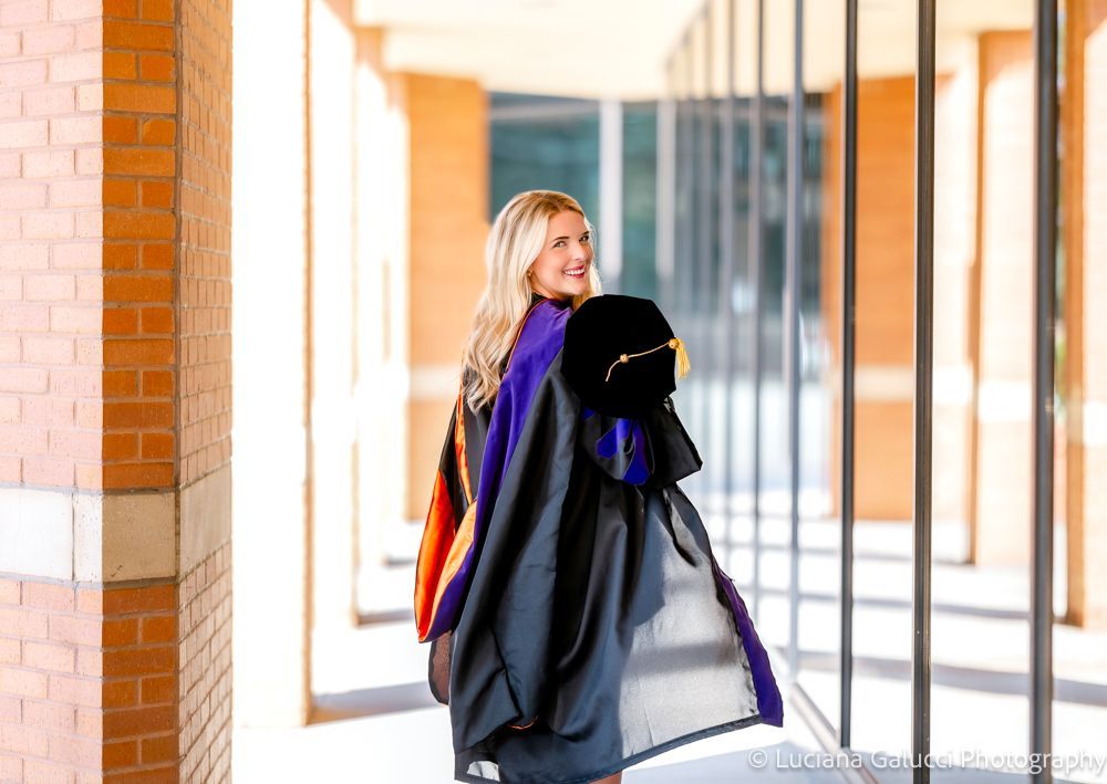 Graduation portrait session at Campbell University School of Law in Raleigh, North Carolina featuring cap and gown near the courthouse
