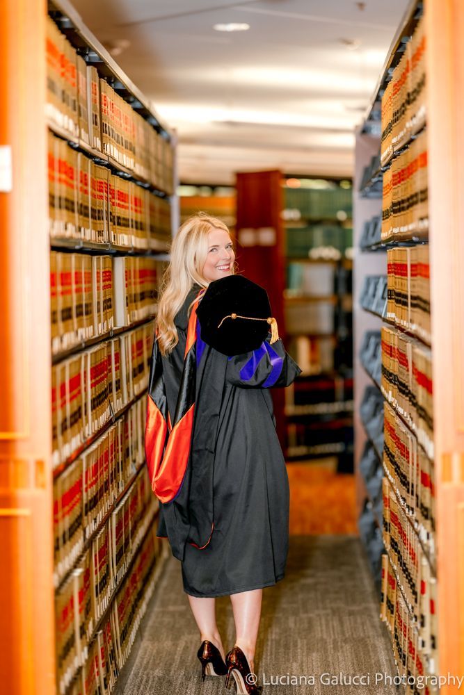 Graduation portrait session by Luciana Galucci Photography at Campbell University School of Law in Raleigh, North Carolina featuring cap and gown near the courthouse