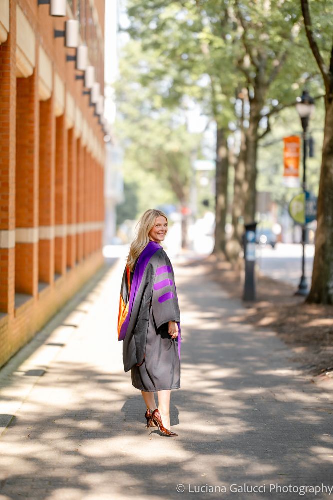 Graduation portrait session by Luciana Galucci Photography at Campbell University School of Law in Raleigh, North Carolina featuring cap and gown near the courthouse