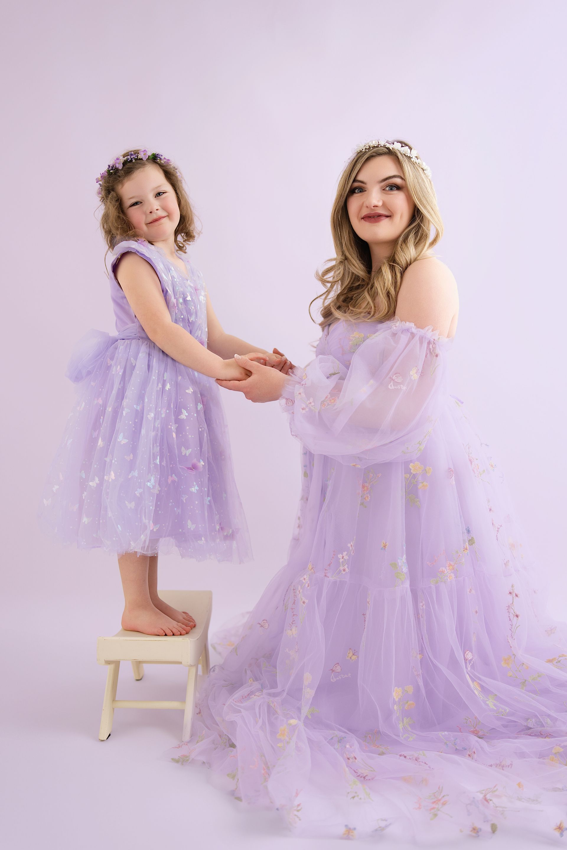 Mother-daughter smile captured during maternity milestone session