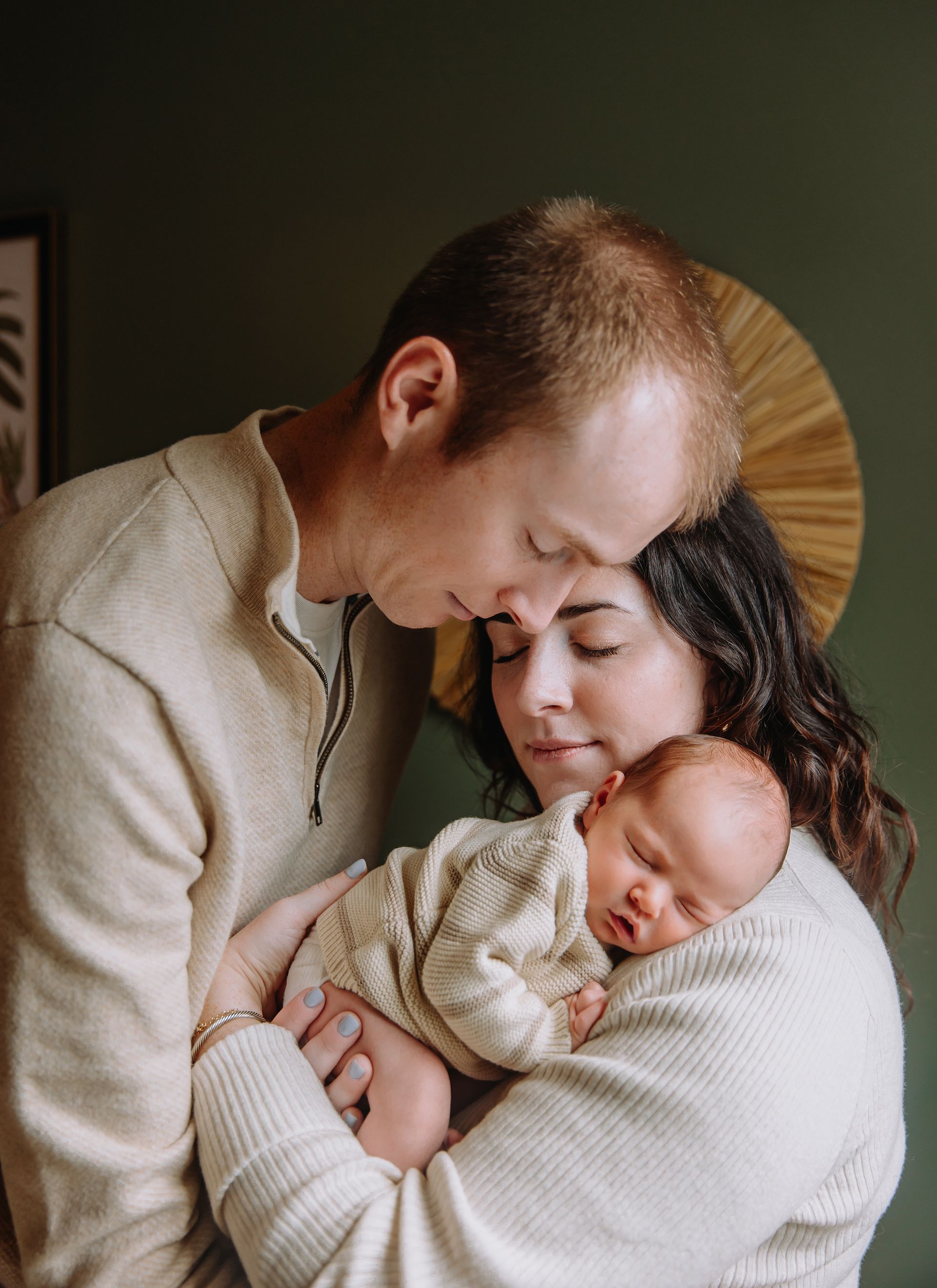 In-home newborn family session in Raleigh, North Carolina with natural window light