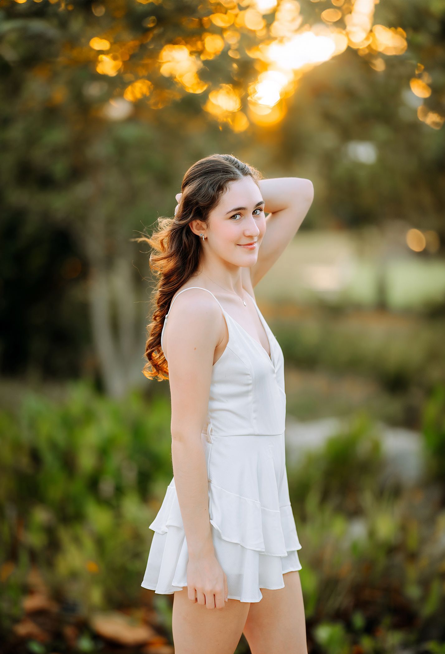 High school senior portrait at Cary Downtown Park during golden hour in Cary, North Carolina
