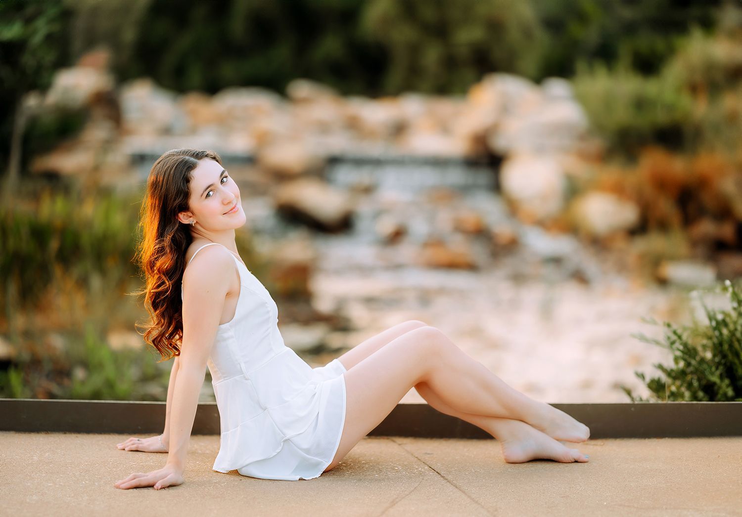 High school senior portrait at Cary Downtown Park during golden hour in Cary, North Carolina
