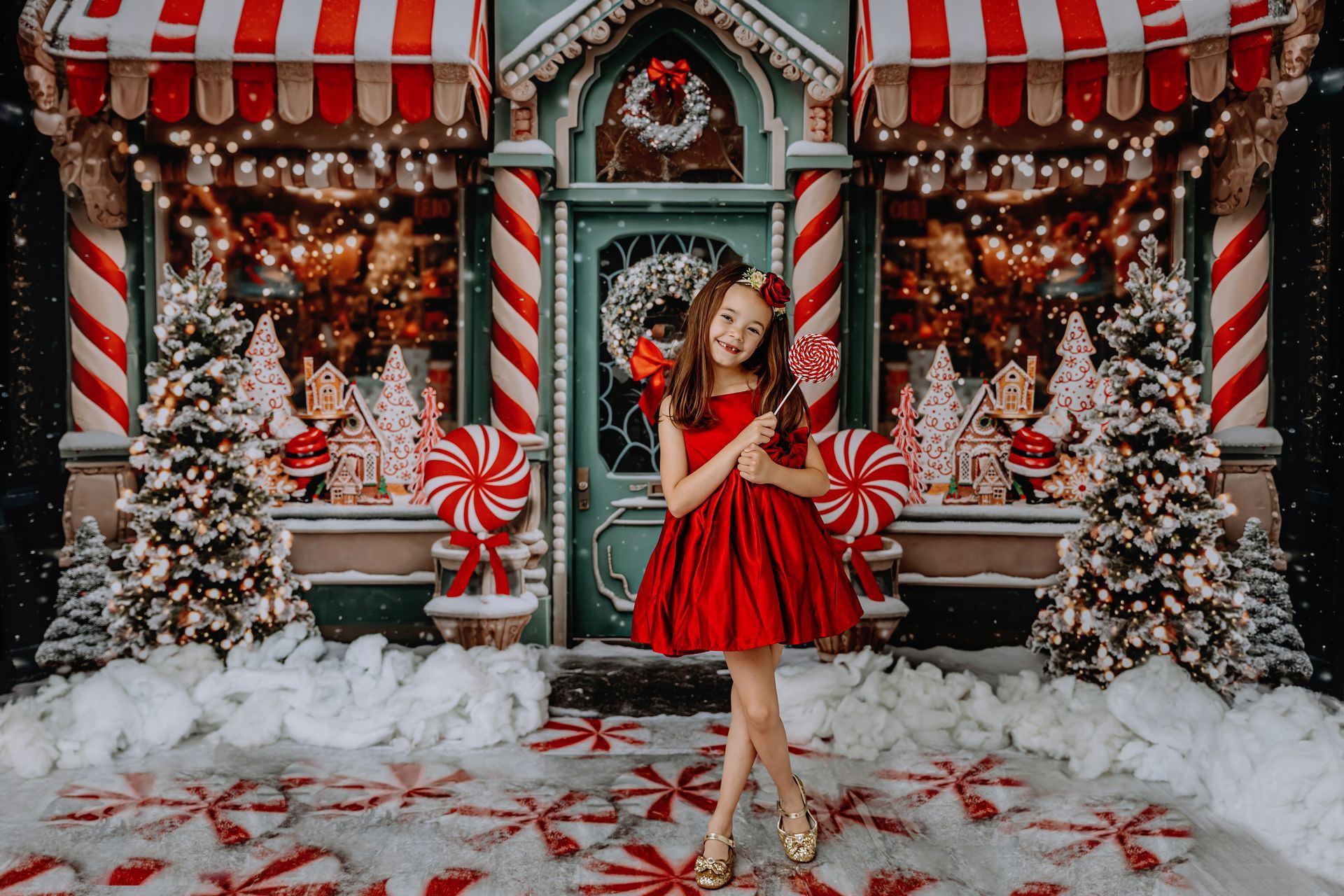 Raleigh NC 2024 Christmas Themed Studio Mini Sessions.
 A whimsical holiday scene featuring candy cane stripes, peppermint accents, and festive decorations, perfect for capturing joyful moments in a cozy studio setting.
